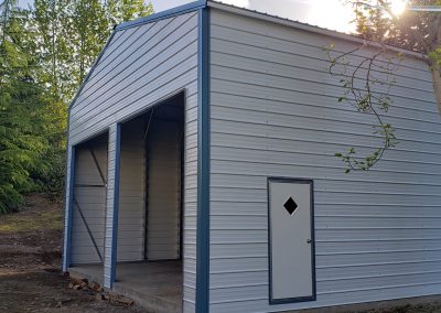 Metal garage, white with blue trim